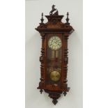 Late 19th century walnut cased Vienna wall clock, horse figure pediment with turned finials,