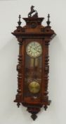 Late 19th century walnut cased Vienna wall clock, horse figure pediment with turned finials,