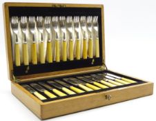 Set of 12 plated fish knives and forks with bone handles in oak case marked 'Fattorini and Sons