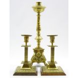 French brass altar candlestick with claw and ball feet H39cms and a pair of brass candlesticks on