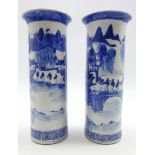 Pair of 19th century Chinese blue and white cylindrical vases decorated with figures and pagodas in