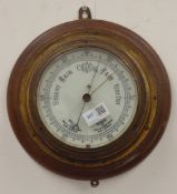 Early 20th century brass bulk head type barometer on circular moulded plaque,