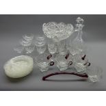 Heavy cut glass punch bow on a socketed stem D26cms, two decanters,