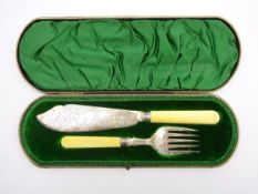 Pair of late Victorian fish servers with engraved silver blades and ivory handles in fitted case,