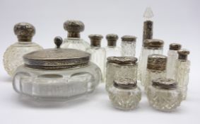 Two cut glass globe scent bottles with silver covers,