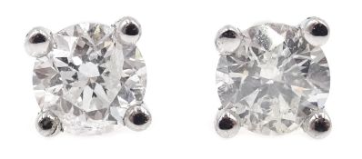 Pair of 18ct white gold diamond stud earrings, stamped 750, diamonds total 0.