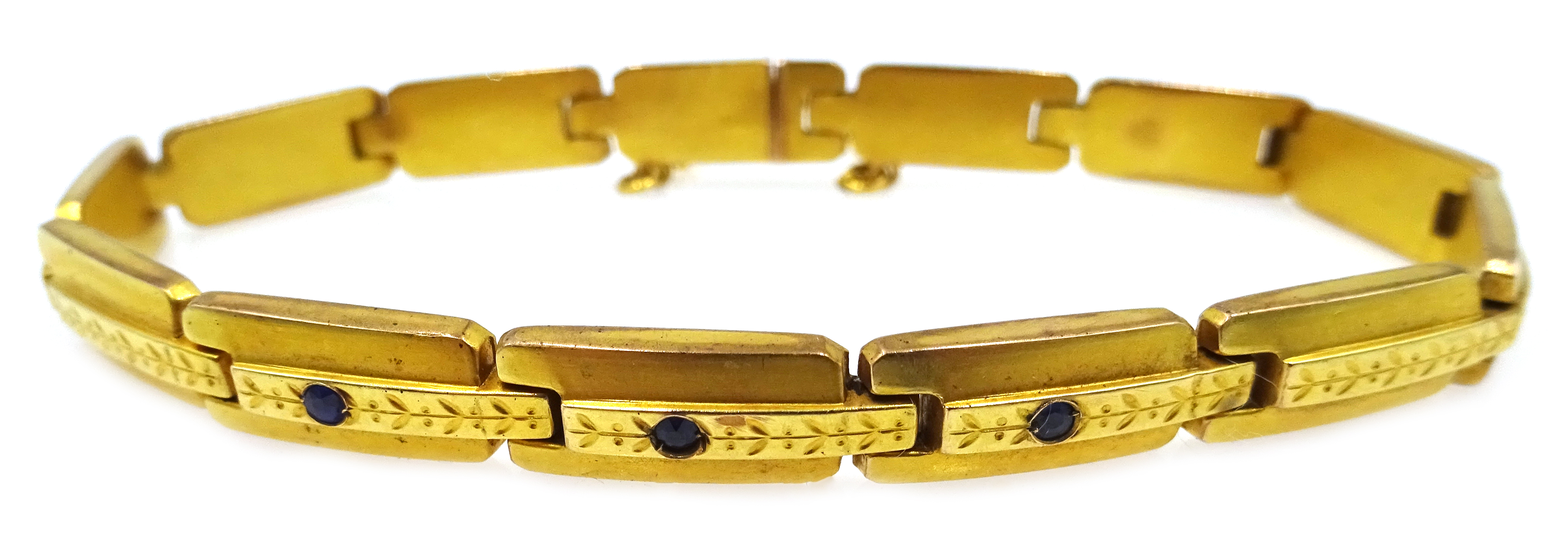 8ct gold link bracelet set with three blue stones,