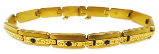 8ct gold link bracelet set with three blue stones,