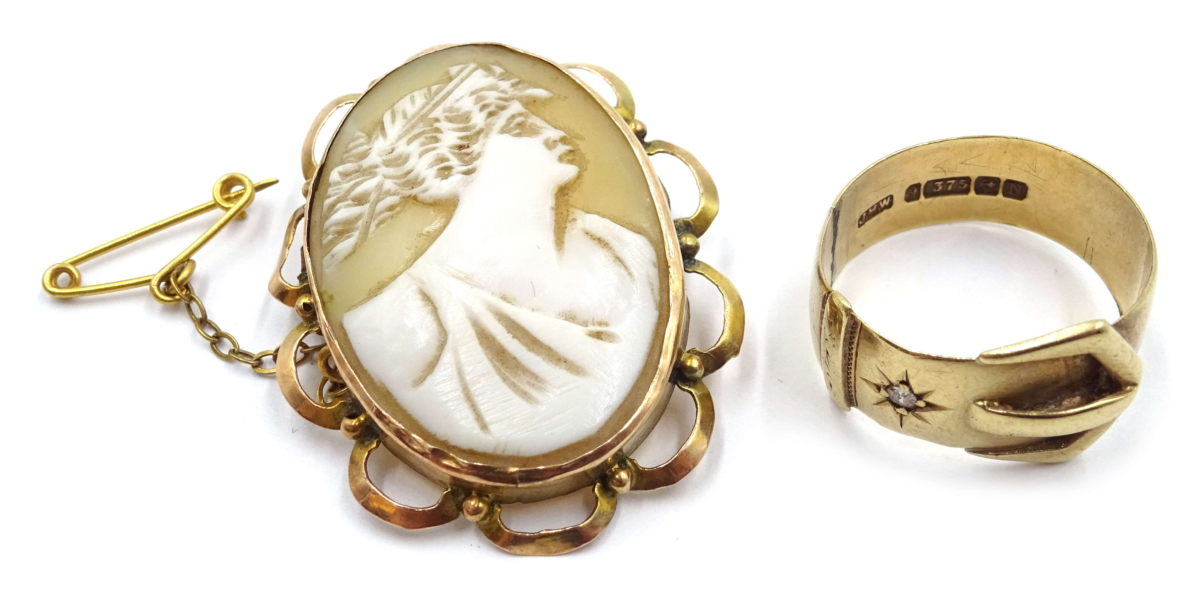 9ct gold buckle ring set with a diamond, Birmingham 1937 and a gold mounted cameo brooch,