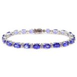 18ct white gold oval tanzanite and round brilliant cut diamond bracelet,