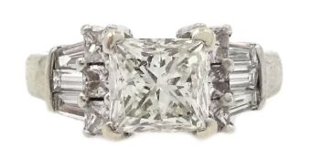 White gold princess cut diamond ring with baguette diamond shoulders, stamped 14K,