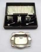 Silver 3 piece condiment set with blue glass liners, cased, Sheffield 1933,