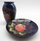 Moorcroft baluster vase in the 'Blue Finch' pattern H10cm and a matching saucer dish D11.