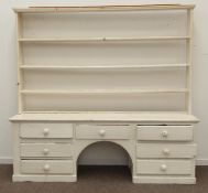 Large early 19th century painted pine dog kennel dresser, three heights plate rack, seven drawers,