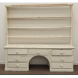 Large early 19th century painted pine dog kennel dresser, three heights plate rack, seven drawers,