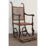 19th century oak framed invalid wheel chair, cane work seat and back,