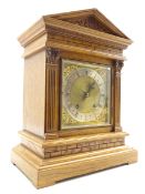 Edwardian oak architectural cased mantle clock, sloped arched top with carved decoration,