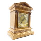 Edwardian oak architectural cased mantle clock, sloped arched top with carved decoration,