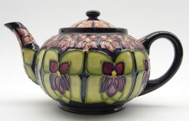 Walter Moorcroft teapot decorated in the Violet pattern, designed by Sally Tuffin,
