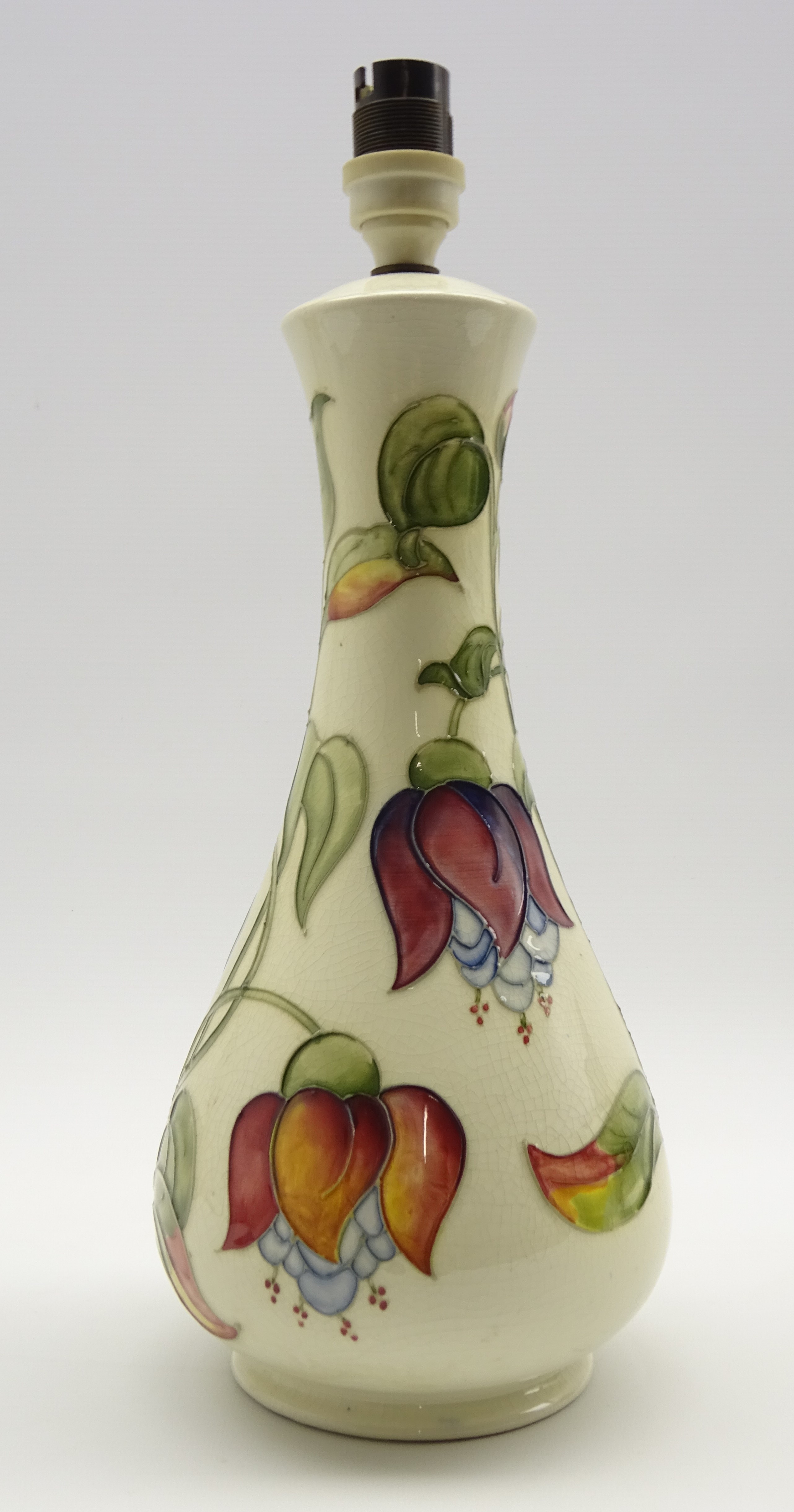 Moorcroft table lamp decorated with the Fuchsia pattern on a cream ground H31cm