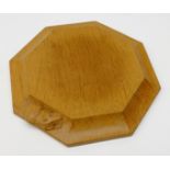 Mouseman oak octagonal teapot stand by Robert Thompson of Kilburn with carved mouse signature W19cm