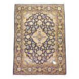 Persian Kashan blue ground rug, lozenge medallion in a field of scrolling foliage, guarded border,