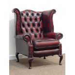 Georgian style wingback armchair upholstered in deeply buttoned ox-blood leather,