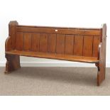 20th century polished pine church pew, panelled back, shaped end supports, W172cm, H94cm,