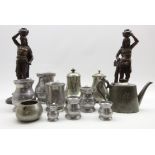 Pair of spelter figures of Egyptian water carriers H40cm, set of 6 American pewter measures,