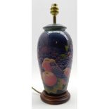 Moorcroft vase shape table lamp decorated in the 'Blue Finch' pattern and on a wooden stand H28cm