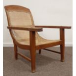 Early 20th century teak and caned plantation style armchair,