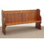 20th century polished pine church pew, panelled back, shaped end supports, W174cm, H94cm,