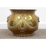 Brass planter with embossed decoration and lion mask ring handles.