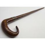 Walking stick with crook handle with a metal collar inscribed 'Made from oak and copper from