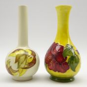Moorcroft bottle shape vase with Hibiscus pattern on a yellow ground and with paper label H17cm
