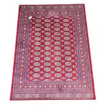 Persian Bokhara design red ground rug/wall hanging,
