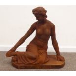 Cast iron classical garden figure of a semi-nude seated maiden,