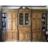 Bespoke figured oak freestanding bookcase/display cupboard, fitted with multiple paneled doors,