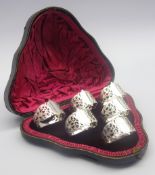 Set of 6 late Victorian silver serviette rings with pierced decoration and in fitted leather case