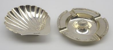 Silver shell shape butter dish on ball feet Sheffield 1900 and a silver circular ashtray Birmingham