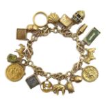 9ct gold fancy link bracelet, with sixteen 9ct gold charms including Scottie dog,