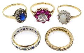 Three gold stone set cluster rings and two stone set eternity rings,