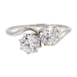 Platinum (tested) two stone diamond crossover ring, each diamond approx 0.