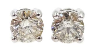 Pair of 18ct white gold diamond stud earrings, stamped 750, diamonds approx 1.