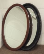 Edwardian mahogany framed beveled oval wall hanging mirror with checkered inlay,