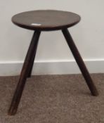 Primitive three legged oak stool, possibly welsh, with circular seat,