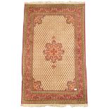 Central Asian design finely knotted red ground rug, floral medallion,