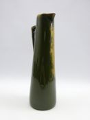 Tall tapered jug decorated in the Kingsware style with The Night Watchman on green and gilt ground,