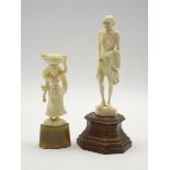 Carved ivory figure of Mahatma Ghandi on a wooden base H18cm and another ivory figure of a lady