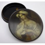 Early 19th Century Stobwasser papier mache circular snuff box the cover painted with a portrait of